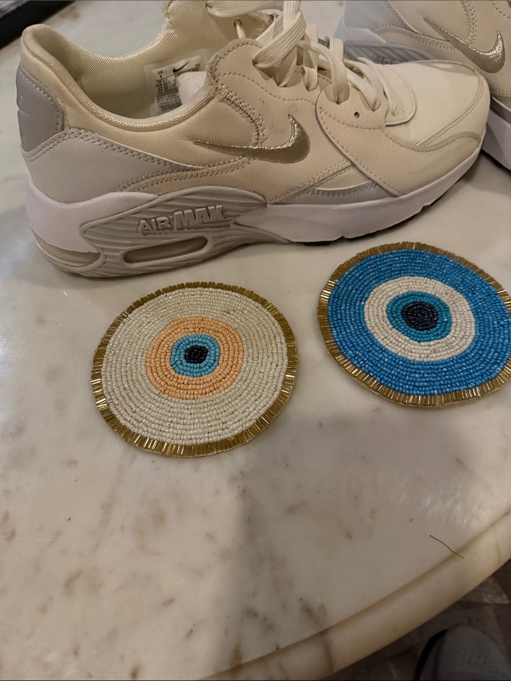 Nike Cream/White Sneakers with Metallic Swoosh